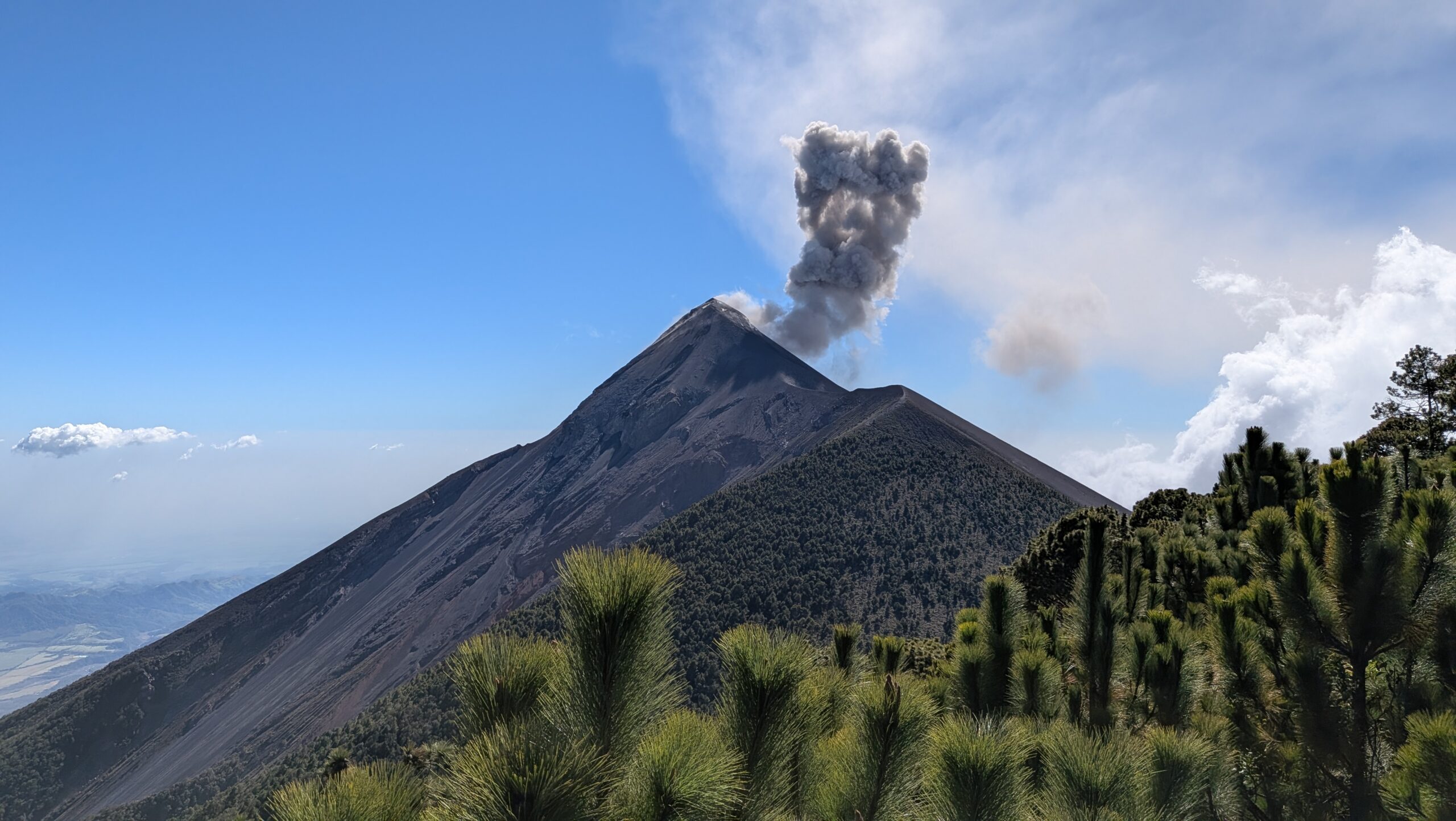 Volcan de Fuego erupting behind Cerveceria 14, Antigua