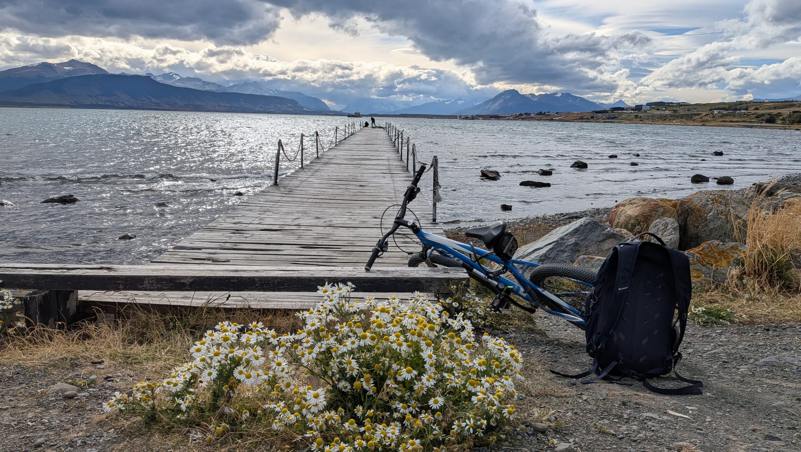 Packed backpack and rolling luggage laid out, gear flat-lay style