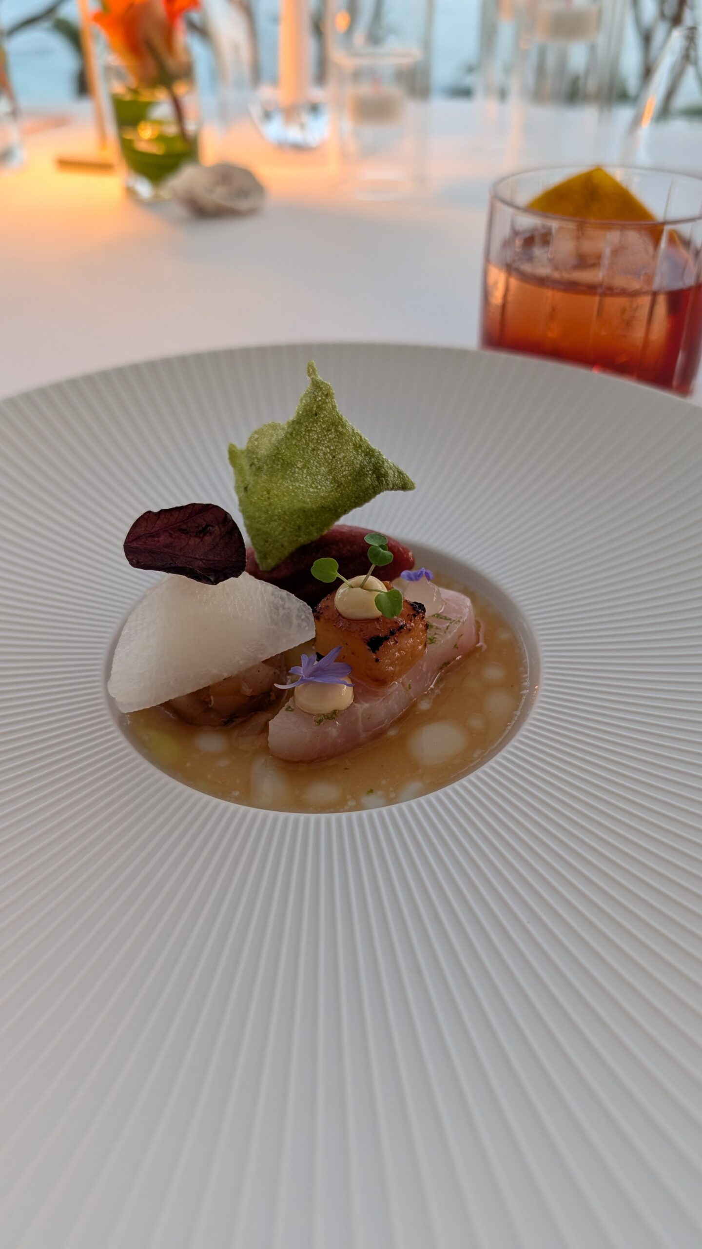 Fine-dining plated dish with wine