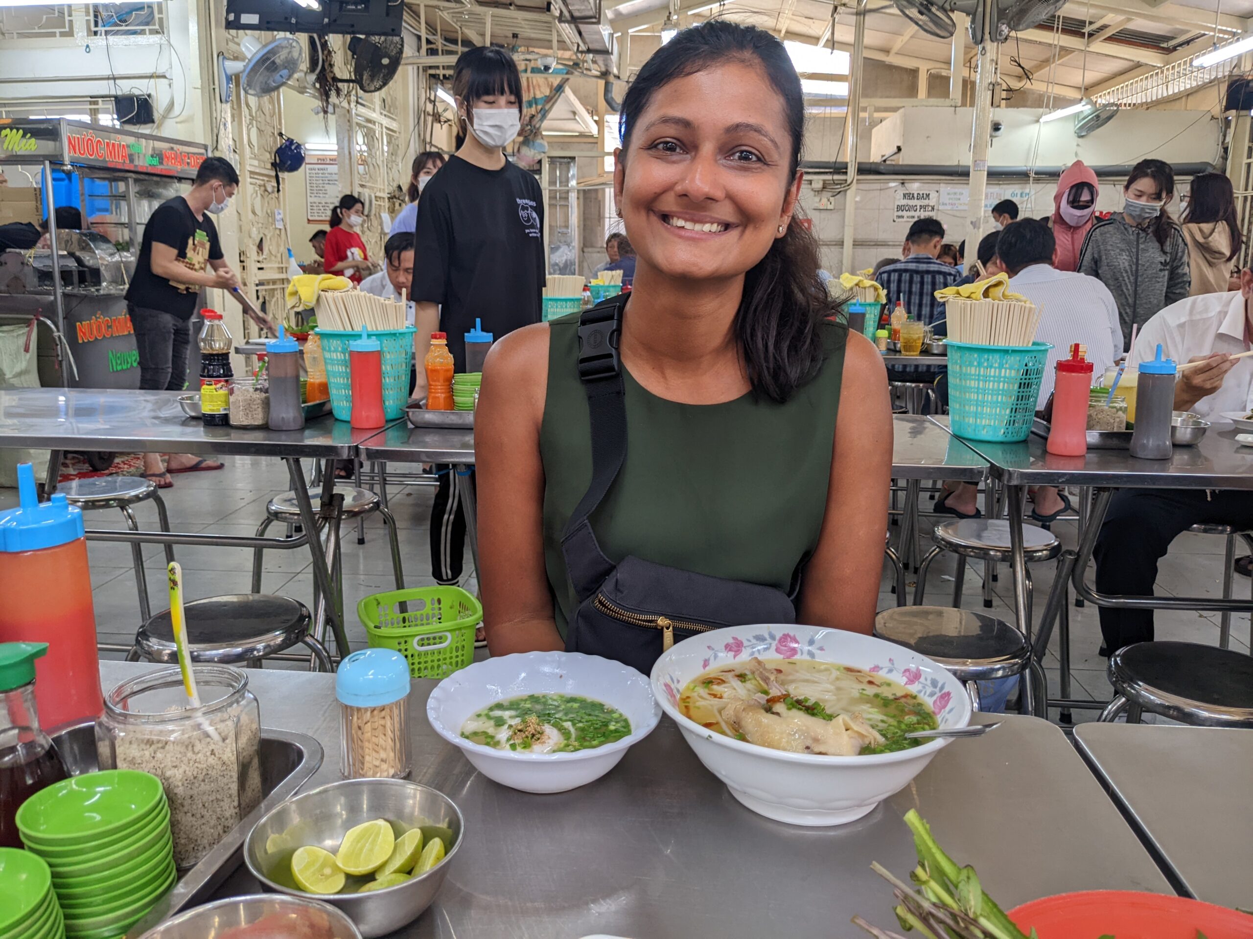 Street food stall next to a sit-down local restaurant
