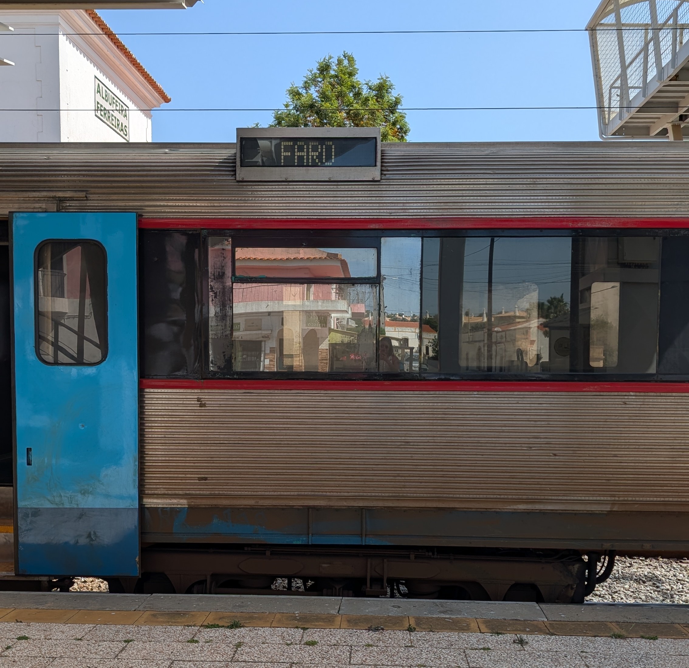 Train departing a station platform